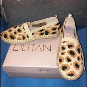 Only tried on, never worn. Bought from Dillards.